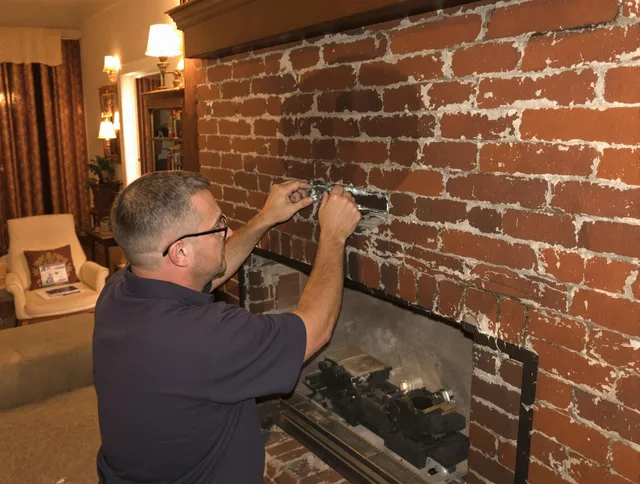 Alhambra Chimney Sweep expert fixing a fireplace in Alhambra, CA